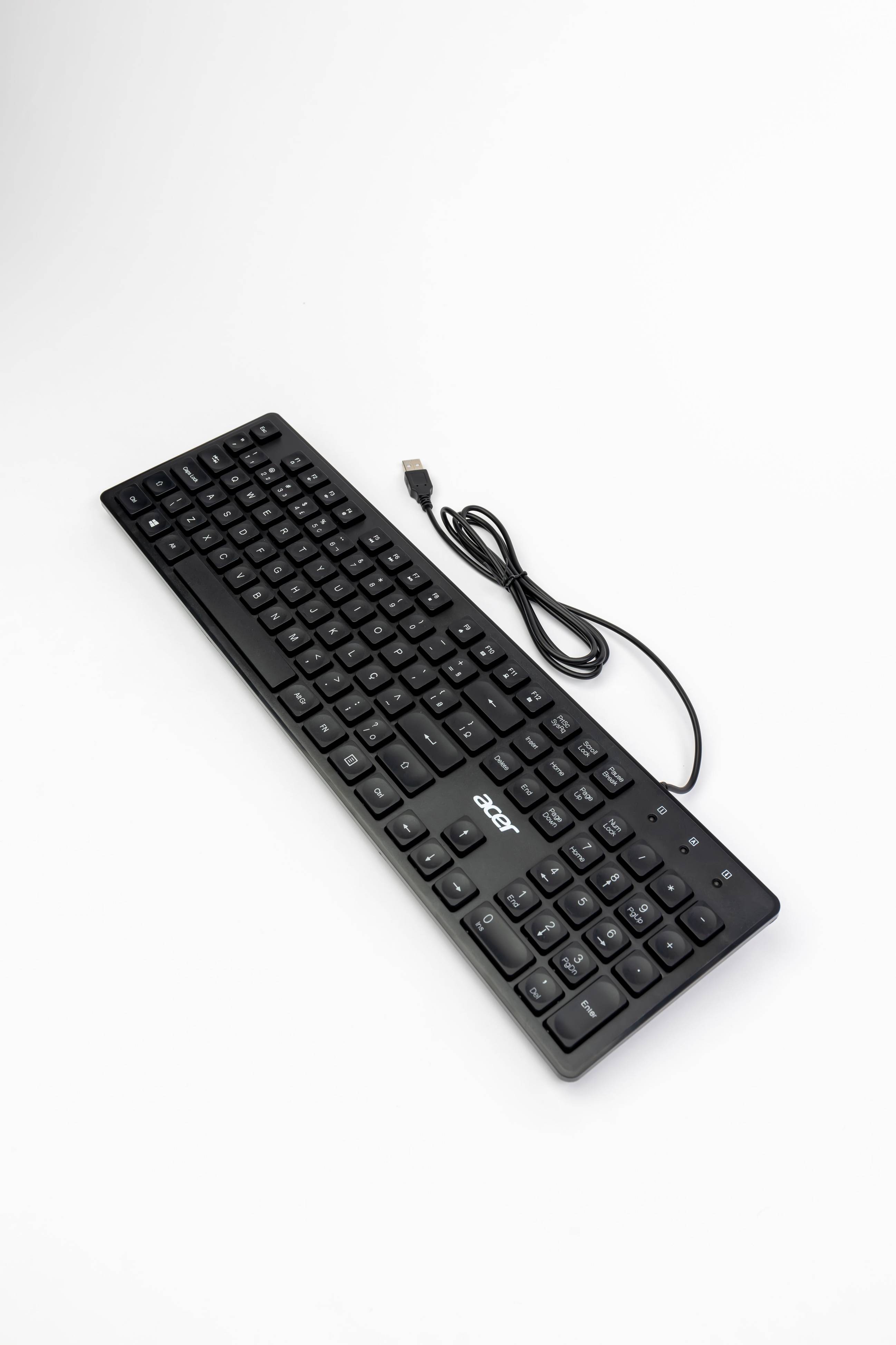 Close view of a computer keyboard and cables with USB connector